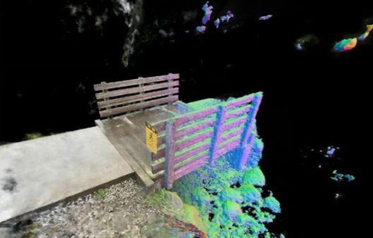 A screenshot of a 3D mesh of an outdoor environment showing a road and a bridge.