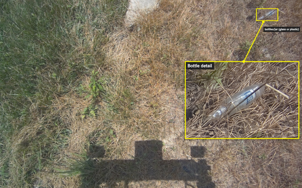 labeled bottle detection in grass, with an enlarged detail of the detected object; user-provided case image